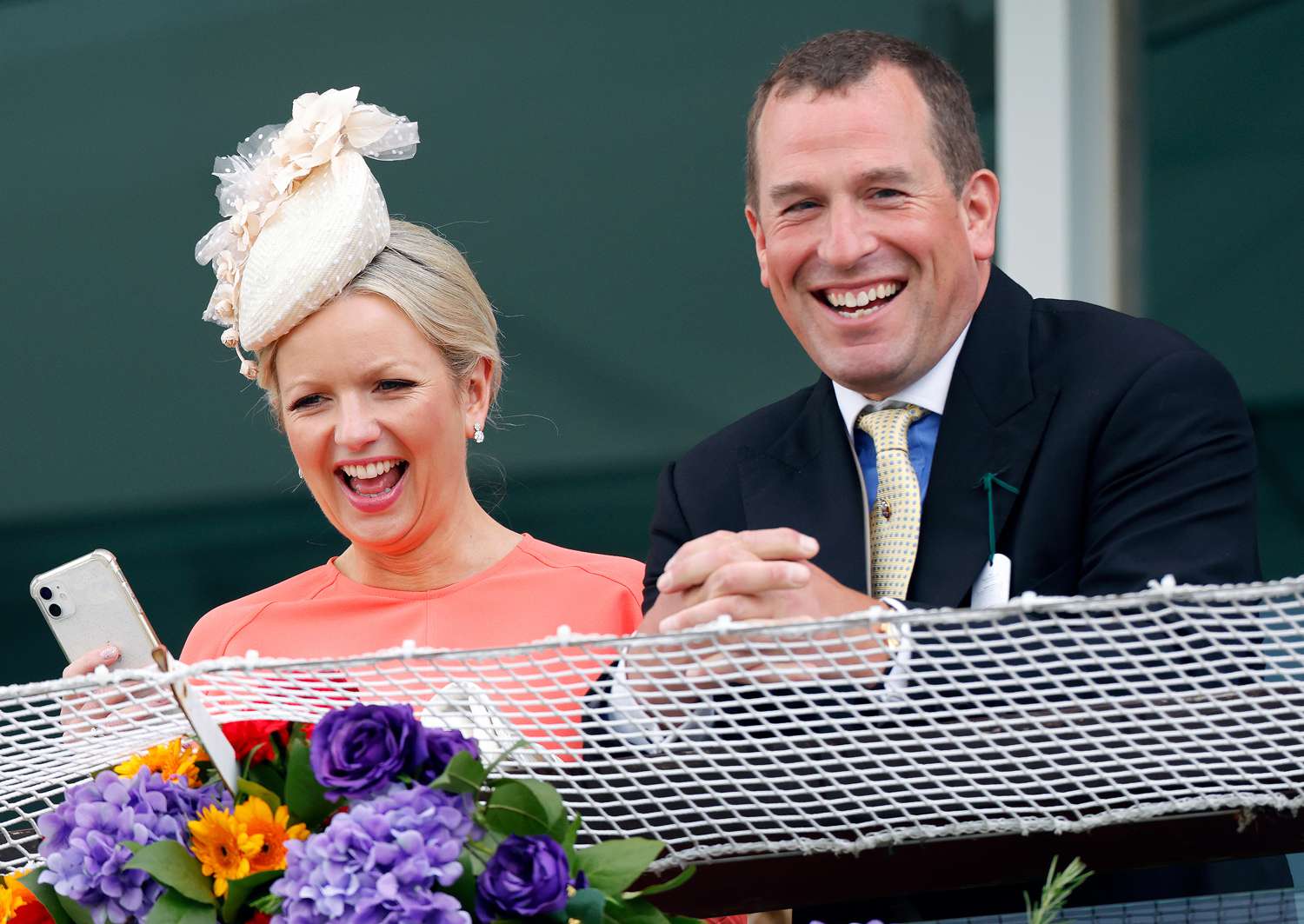 Lindsay Wallace and Peter Phillips watch the racing from the royal box as they attend The Epsom Derby at Epsom Racecourse on June 4, 2022 in Epsom, England.