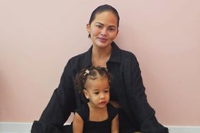 chrissy teigen and daughter at a ballet studio