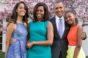 Barack Obama, Michelle Obama, and daughters Malia (L) and Sasha (R) pose for a family portrait in the Rose Garden of the White House on Easter Sunday, April 5, 2015 in Washington, DC