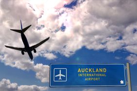 Airplane silhouette landing in Auckland, New Zealand.