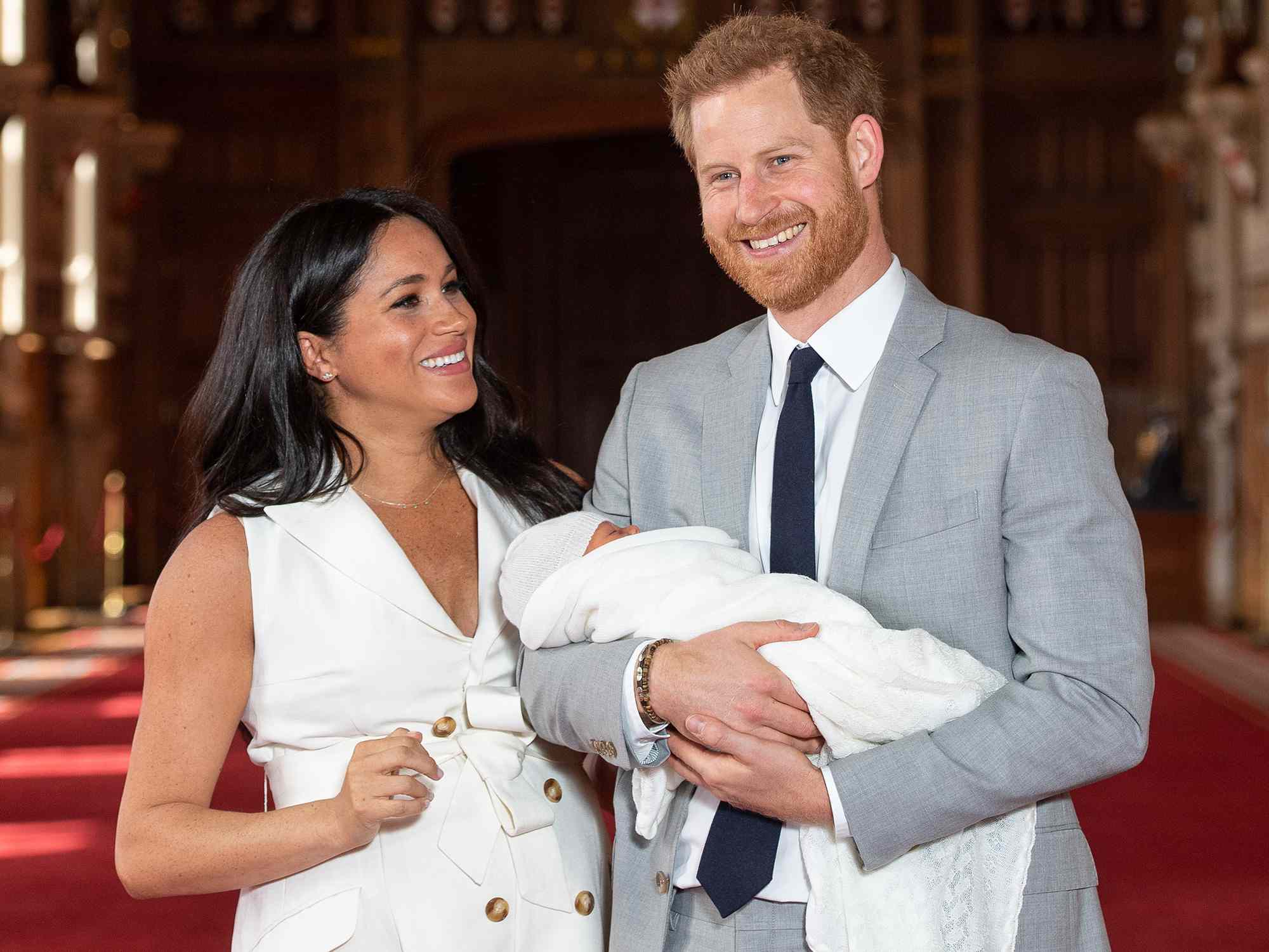 Prince Harry, Duke of Sussex and Meghan, Duchess of Sussex, pose with their newborn son Archie Harrison Mountbatten-Windsor