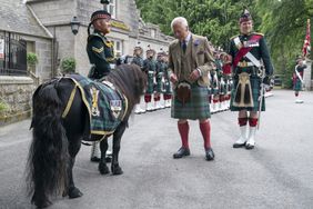 King Charles III meets Shetland pony Cpl Cruachan IV (mascot of the Royal Regiment of Scotland) during an inspection of Balaklava Company, 5th Battalion, The Royal Regiment of Scotland, at the gates of Balmoral, as he takes up summer residence at the castle.