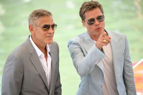 Actors Brad Pitt and George Clooney arrive at the Casino pier during the 81st Venice International Film Festival at Venice Lido, on September 1, 2024 