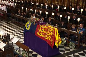 Queen Elizabeth II Funeral- St. Georges Cathedral , Coffin with Meghan Harry Charlotte Kate George William sitting first row