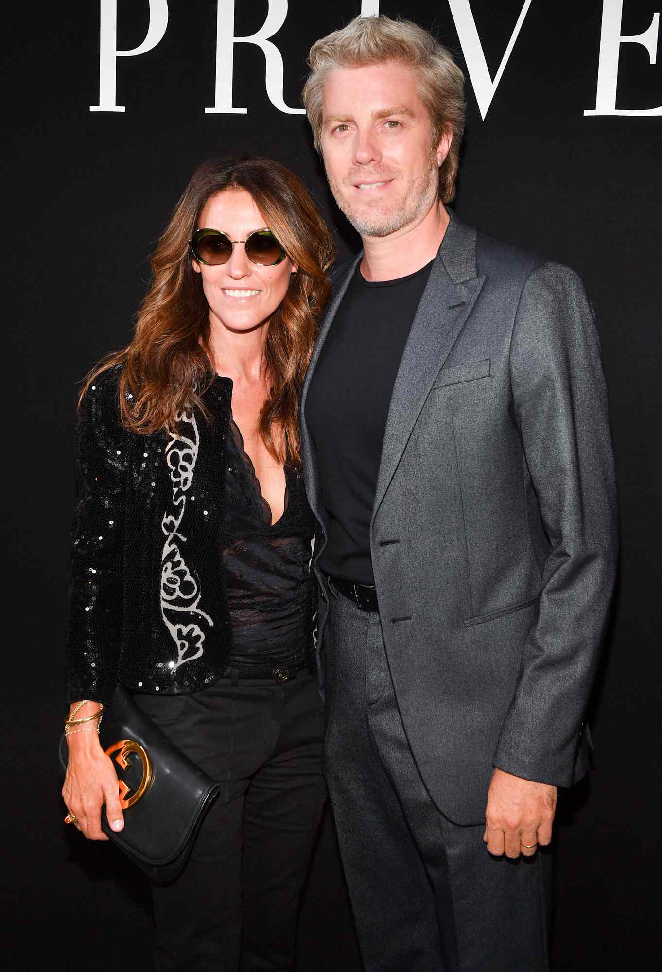 Kyle Eastwood (R) and his wife Cynthia Ramirez (L) attends the Giorgio Armani Prive Haute Couture Fall/Winter 2018-2019 show as part of Haute Couture Paris Fashion Week on July 3, 2018 in Paris, France