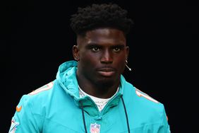 Tyreek Hill #10 of the Miami Dolphins takes the field prior to a preseason game against the Washington Commanders at Hard Rock Stadium