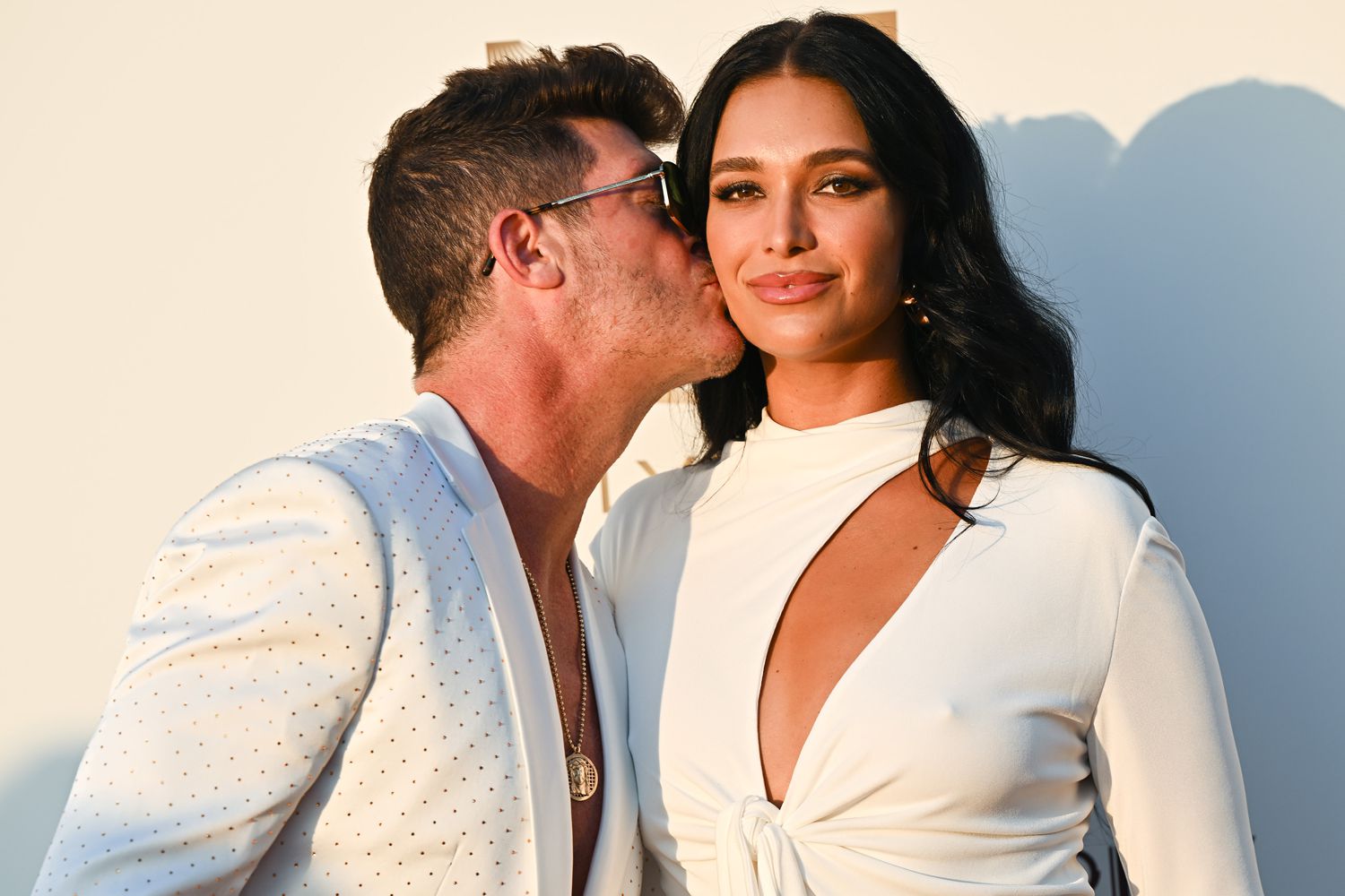 Robin Thicke and April Love Geary attend the "Knights Of Charity Gala" Photocall at Chateau de la Croix des Gardes 