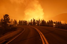 The Line Fire slows for the evening after a sudden a late-season monsoon rain storm temporarily halted its 4,000-foot elevation climb up to the edge of mountain communities on September 7, 2024 near Running Springs, California. Thousands of people fled the fire, which began at the foothill city of Highland in heatwave conditions. It has grown to 17,459 acres and remains 0 percent contained