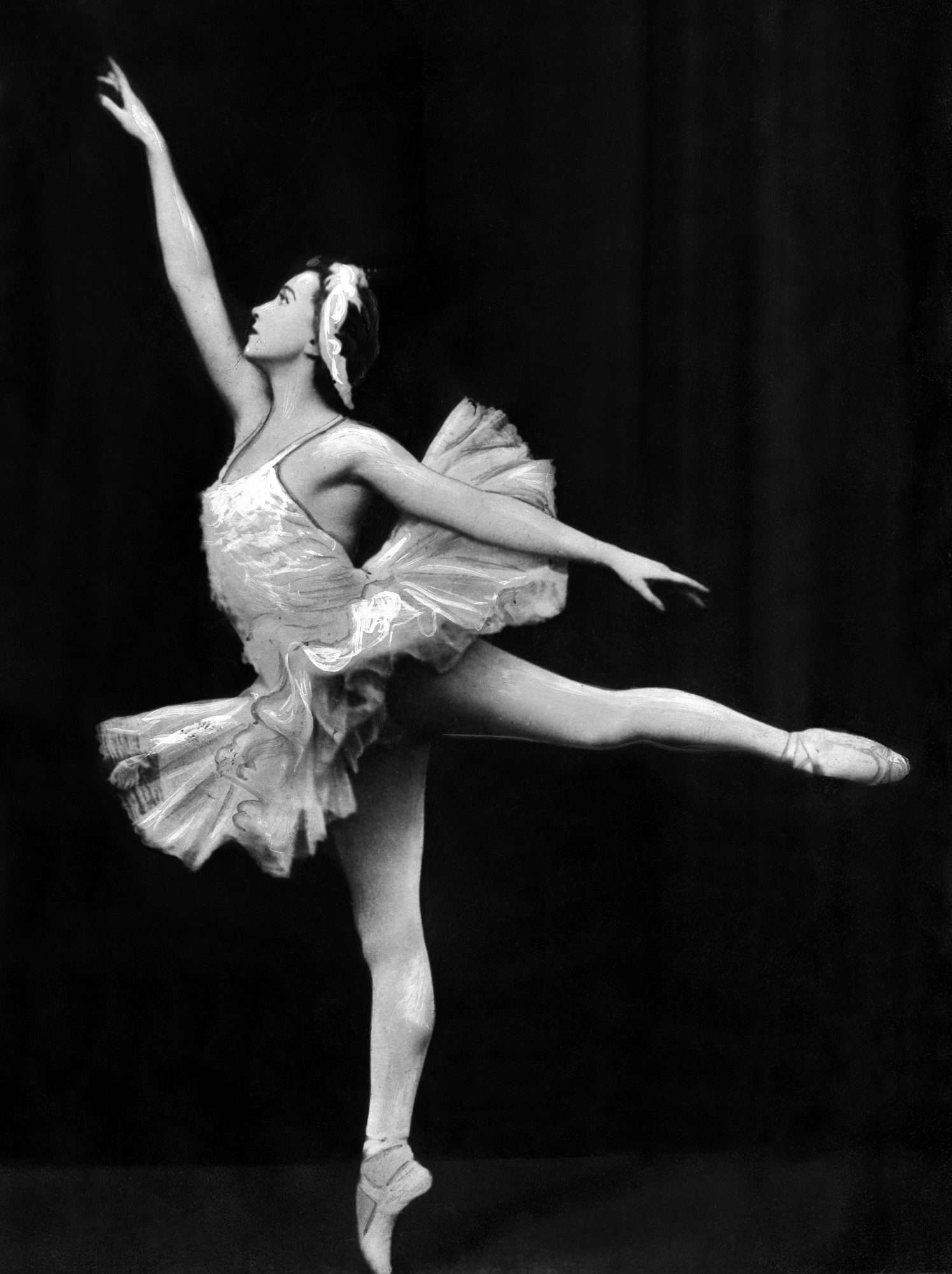 Galina Ulanova performing onstage in a traditional ballerina costume.