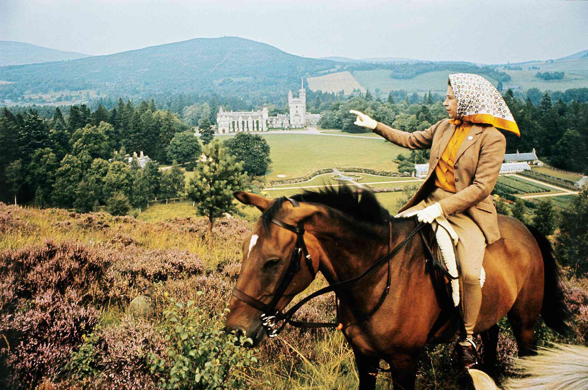 The Queen on horse looking to Balmoral