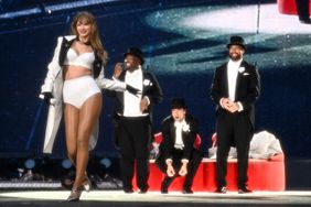 Taylor Swift is joined on stage by Travis Kelce (R), during "Taylor Swift | The Eras Tour" at Wembley Stadium