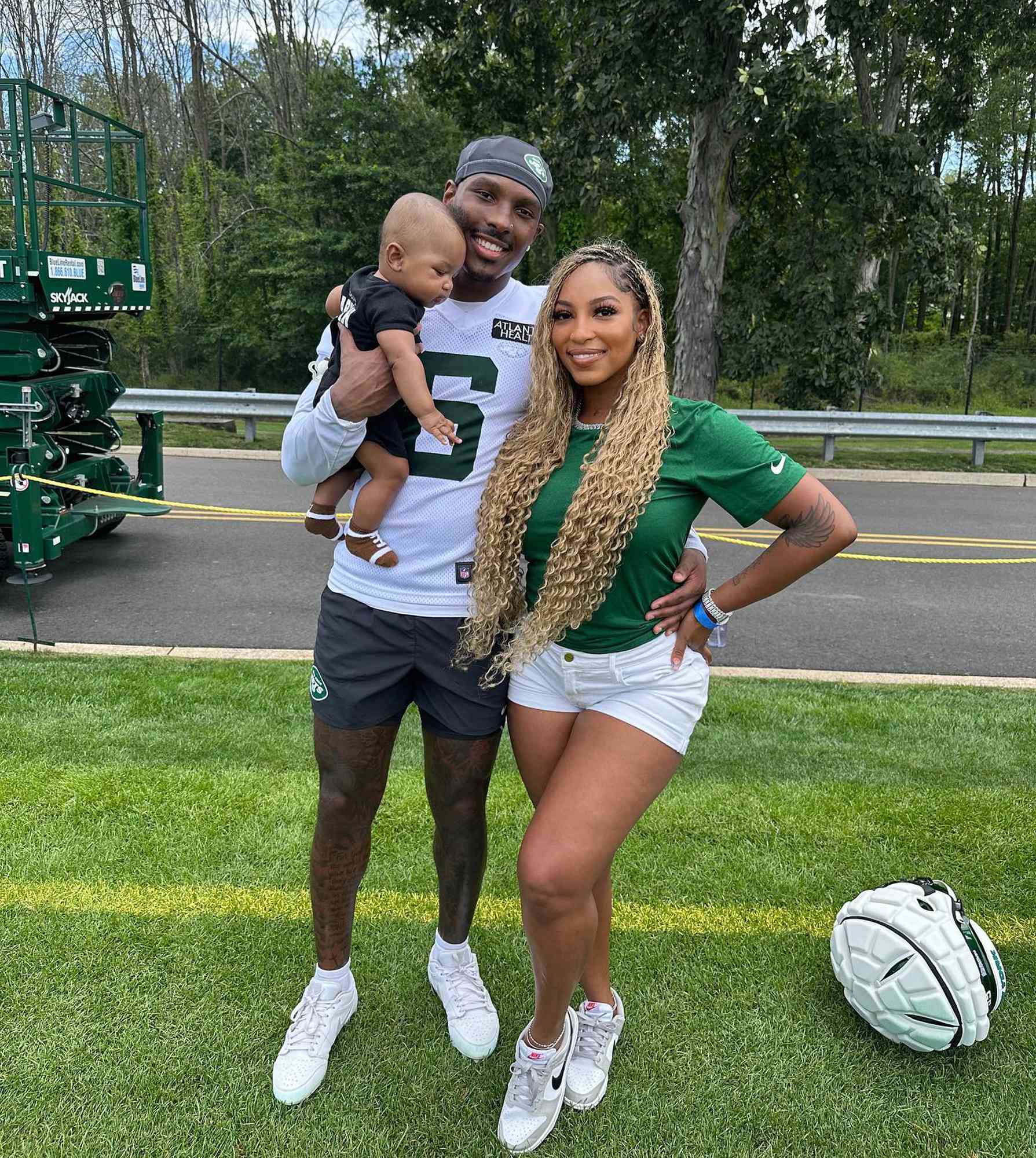 Mecole Hardman Jr. and Chariah Gordon with their son.