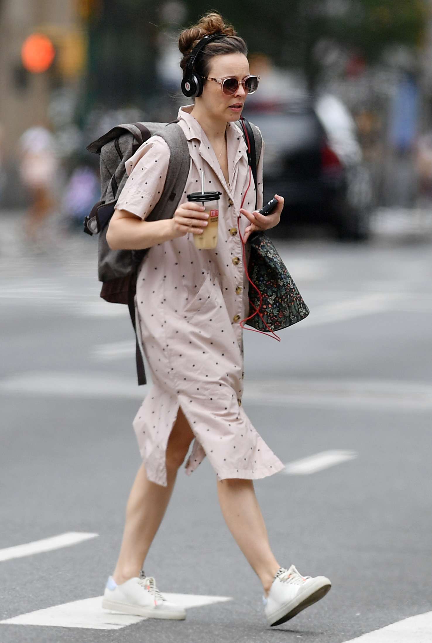 Rachel McAdams is spotted on a coffee run in New York City. The American actress and broadway star wore Beats headphones, backpack, polka dot dress