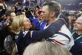 Tom Brady #12 of the New England Patriots hugs his mother Galynn after the Patriots defeat the Los Angeles Rams 13-3 during Super Bowl LIII at Mercedes-Benz Stadium on February 3, 2019 in Atlanta, Georgia. (Photo by Jamie Squire/Getty Images