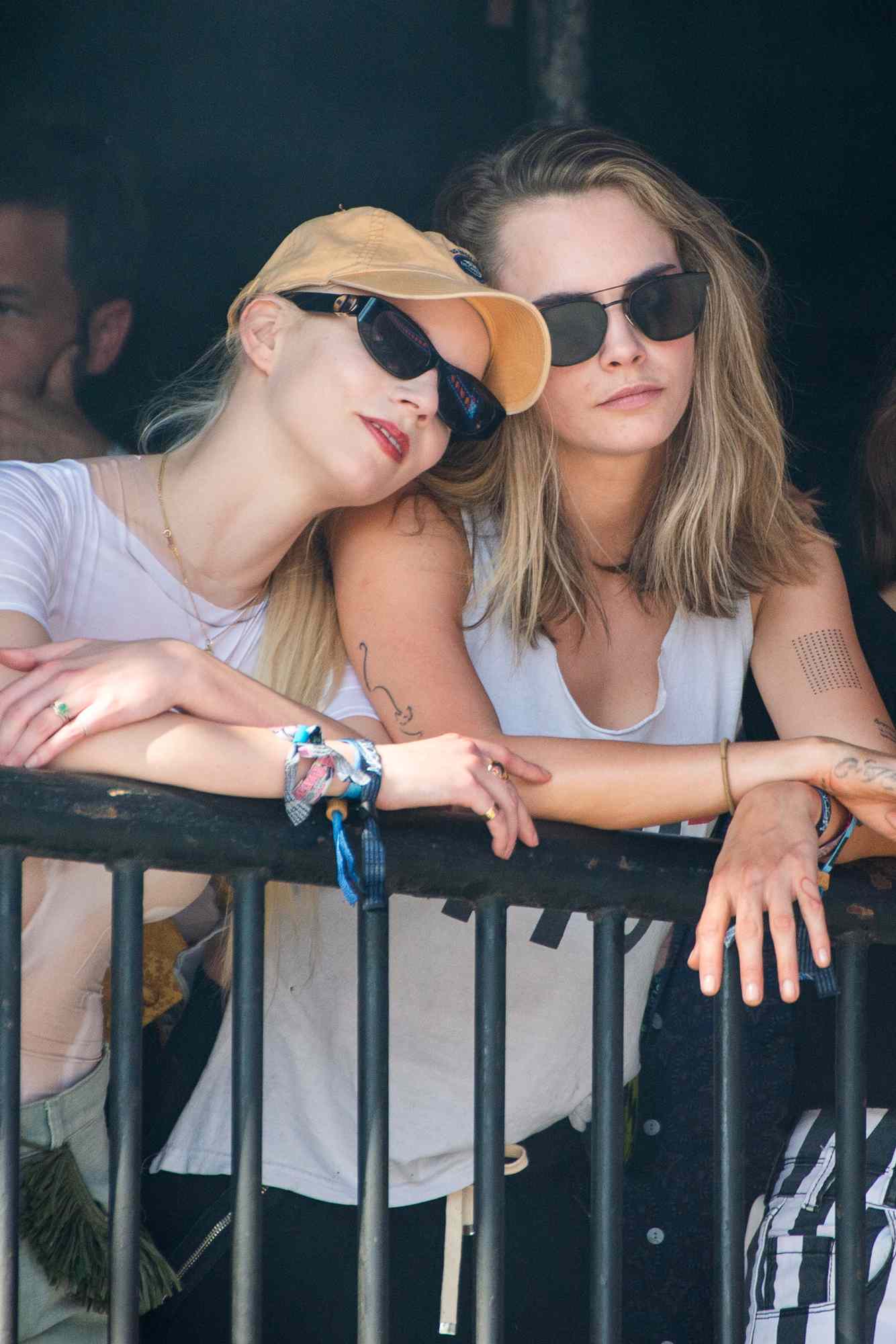 Anya Taylor-Joy and Cara Delevingne watch The Last Garden Party perform during day four of Glastonbury Festival 2024 at Worthy Farm, Pilton on June 29, 2024 in Glastonbury, England.