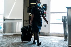 A flight attendant exits a Delta Airlines flight at the Ronald Reagan National Airport on July 22, 2020 in Arlington, Virginia.