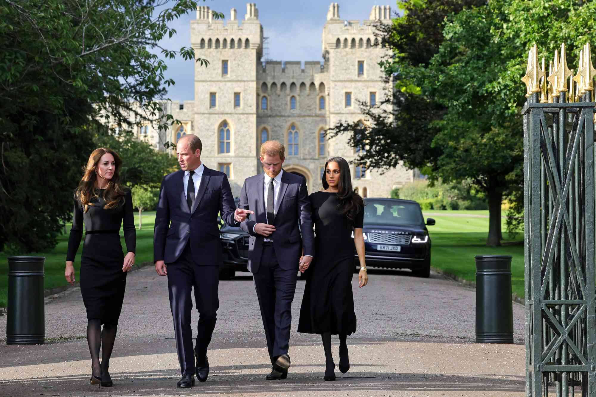 WINDSOR, ENGLAND - SEPTEMBER 10: Catherine, Princess of Wales, Prince William, Prince of Wales, Prince Harry, Duke of Sussex, and Meghan, Duchess of Sussex on the long Walk at Windsor Castle on September 10, 2022 in Windsor, England. Crowds have gathered and tributes left at the gates of Windsor Castle to Queen Elizabeth II, who died at Balmoral Castle on 8 September, 2022. (Photo by Chris Jackson - WPA Pool/Getty Images)