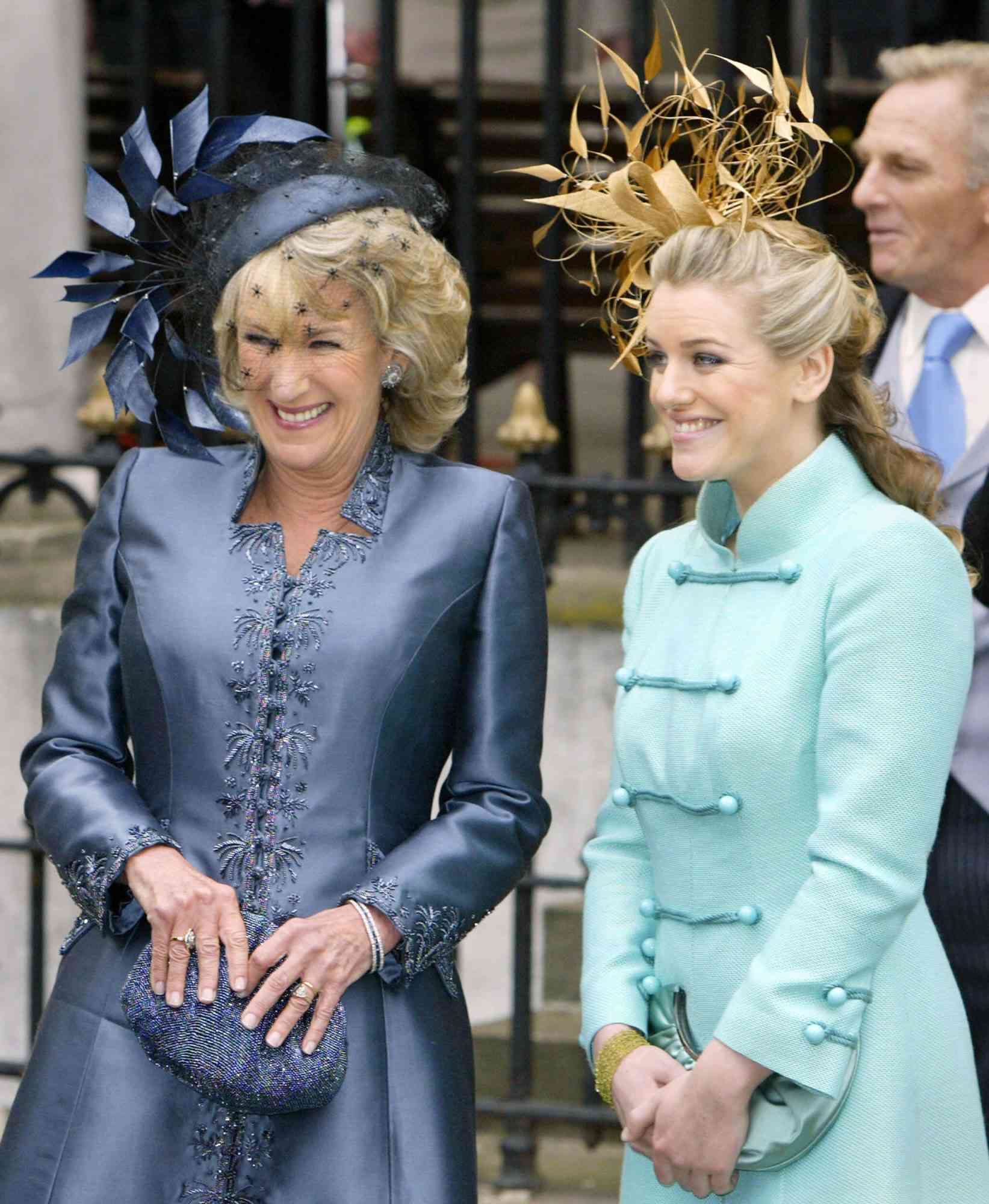 WINDSOR, United Kingdom: Camilla Parker Bowles' sister Annabel Elliot (L) and daughter Laura Parker Bowles (R) watch as the Royal party drive away from theThe Guildhall in Windsor where Prince Charles married Camilla Parker Bowles in a private civil ceremony 09 April 2005. AFP PHOTO/ADRIAN DENNIS (Photo credit should read ADRIAN DENNIS/AFP via Getty Images)