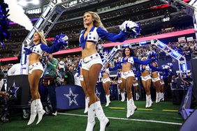 Dallas Cowboys cheerleaders dance prior to an NFL football game against the Washington Commanders at AT&T Stadium on November 23, 2023 in Arlington, Texas.