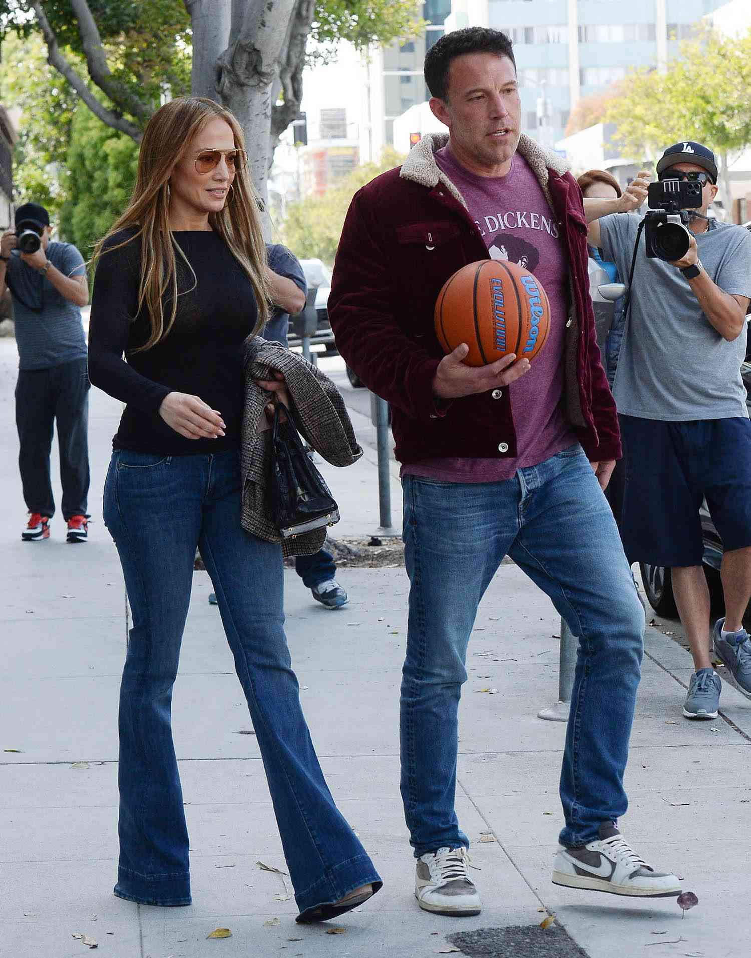 Ben Affleck is joined by both Jennifer Lopez and Jennifer Garner at his son's basketball game in Los Angeles.