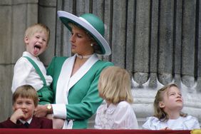 LONDON, UNITED KINGDOM - JUNE 11: Prince Harry Sticking His Tongue Out Much To The Suprise Of His Mother, Princess Diana At Trooping The Colour With Prince William, Lady Gabriella Windsor And Lady Rose Windsor Watching From The Balcony Of Buckingham Palace (Photo by Tim Graham Photo Library via Getty Images)