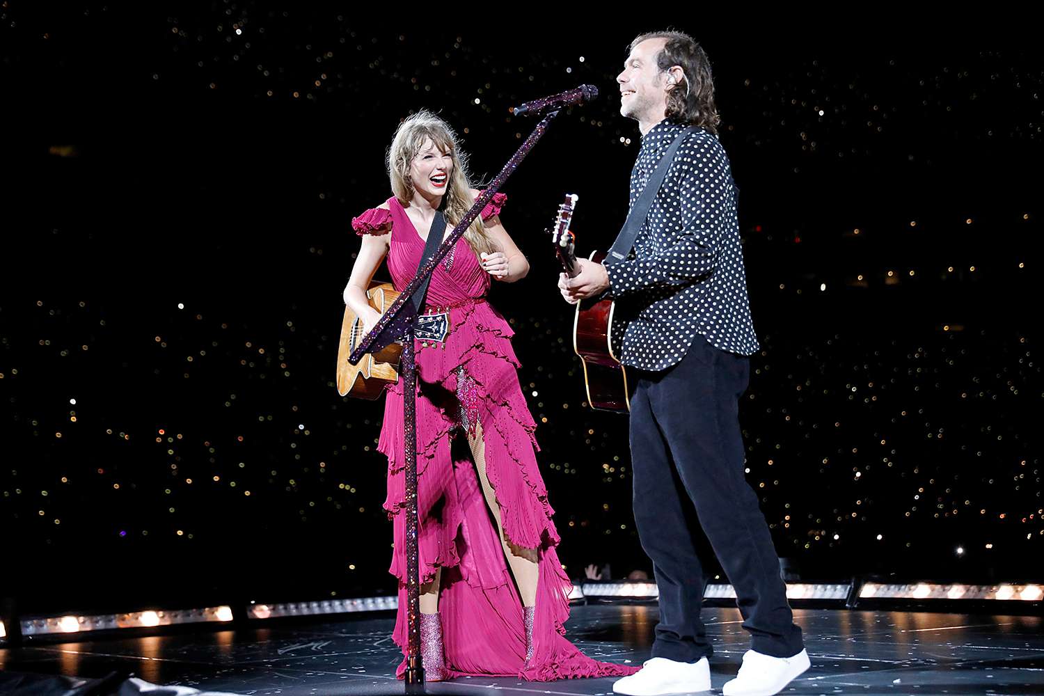 Taylor Swift and Aaron Dessner perform onstage during "Taylor Swift | The Eras Tour" at Raymond James Stadium on April 14, 2023 in Tampa, Florida.