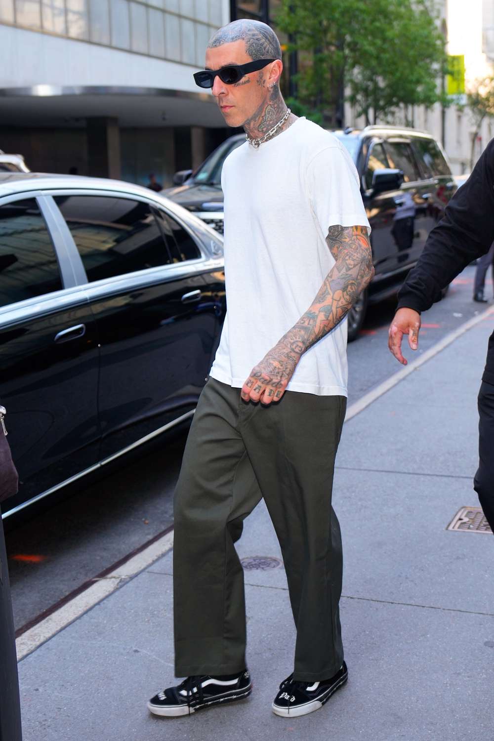 Travis Barker is spotted exiting his hotel in New York City. The sighting comes after the Blink 182 frontman made headlines after he ran a 5K marathon hours before performing a sold out show in NYC.