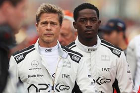 Brad Pitt, star of the upcoming Formula One based movie, Apex, and Damson Idris, co-star of the upcoming Formula One based movie, Apex, walk on the grid during the F1 Grand Prix of Great Britain at Silverstone Circuit