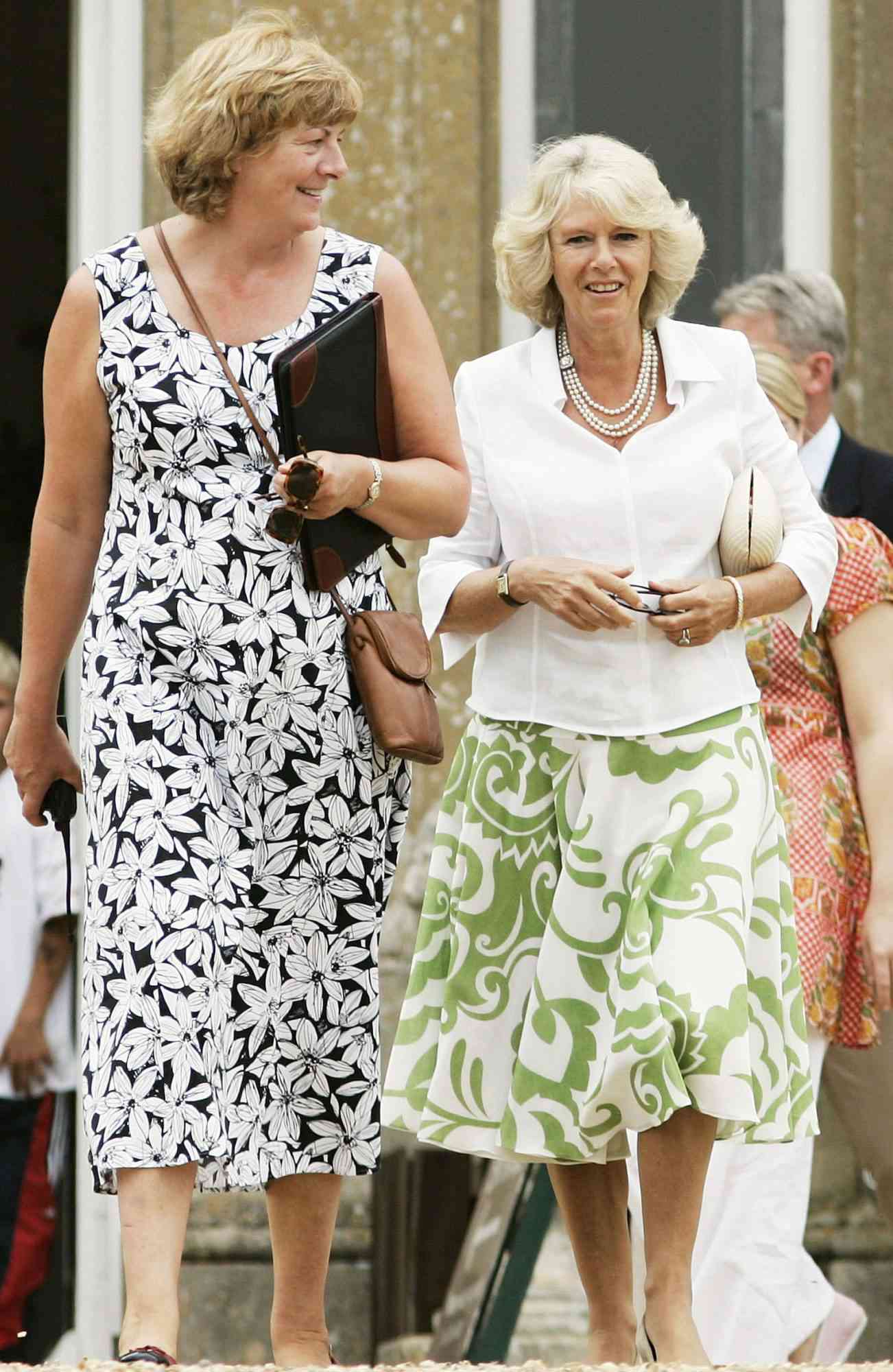 WILTSHIRE, ENGLAND - JULY 22: Camilla, Duchess of Cornwall with Lord and Lady Lansdowne at their home Bowood House for a Dog Show and Country Fair held in support of the Macmillan Cancer Relief charity on July 22, 2006 in Wiltshire, England. (Photo by Tim Graham Photo Library via Getty Images)