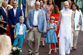 Prince Albert II (2nd L), Princess Charlene (R), Prince Jacques (L), and Princess Gabriella (2nd R) of Monaco arrive to take part in the traditional "U Cavagnetu" Monaco picnic, in Monaco, September 3, 2022. (Photo by ERIC GAILLARD / POOL / AFP) (Photo by ERIC GAILLARD/POOL/AFP via Getty Images)