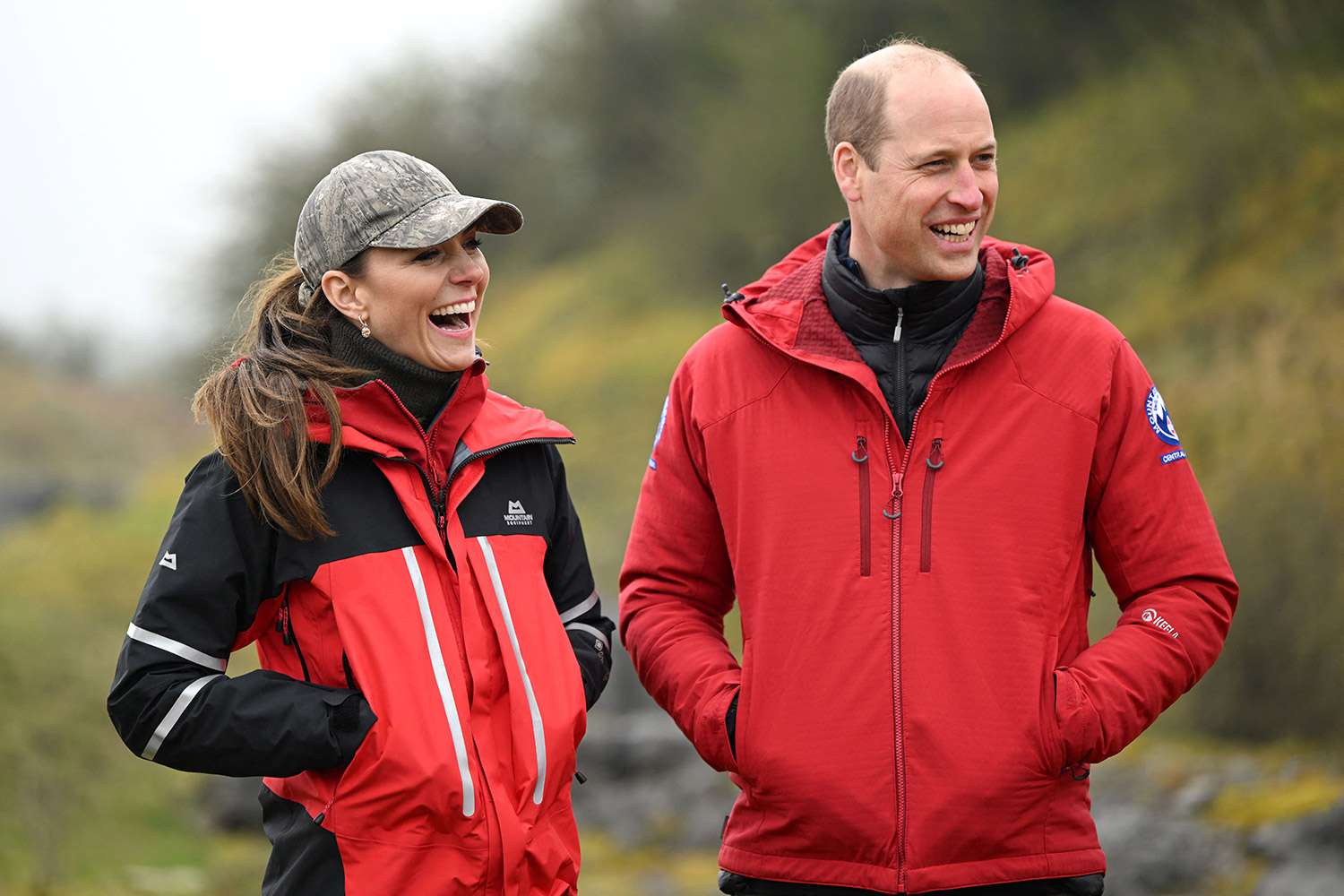 Britain's Prince William, Prince of Wales and Britain's Catherine, Princess of Wales react as they visit the Central Beacons Mountain Rescue Team as part of a tour in Wales, on April 27, 2023