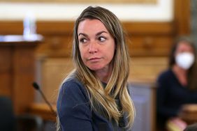 Karen A. Read, 42 girlfriend of the late Boston Police officer John OKeefe, looks at her family in Dedham, MA on June 10, 2022. 