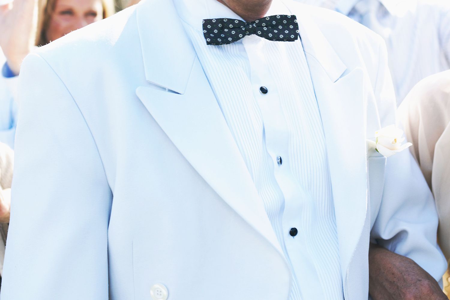 Male wearing white suit to wedding