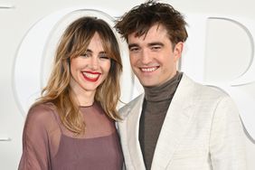 Suki Waterhouse and Robert Pattinson attend the Dior Fall 2023 Menswear Show on December 03, 2022 in Giza, Egypt.