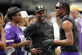 Justin Jefferson with his mother Elaine, and father, John, ahead of an NFL Preseason game between the Minnesota Vikings and the San Francisco 49ers on August 20, 2022.