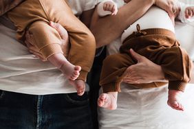 Parents holding young babies, close-up