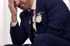 Stock image of upset groom at a wedding