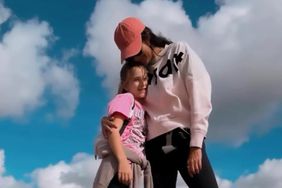 Emma Heming Willis and daughter by a heart cloud