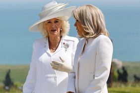 Queen Camilla (L) and French President's wife Brigitte Macron attend the UK Ministry of Defence and the Royal British Legion's commemorative ceremony marking the 80th anniversary of the World War II "D-Day" 