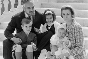 Prince Rainier and Princess of Monaco pose on the steps of the palace with their children: Princess Stephanie , 14 months; Princess Caroline, 9; and Prince Albert, 8