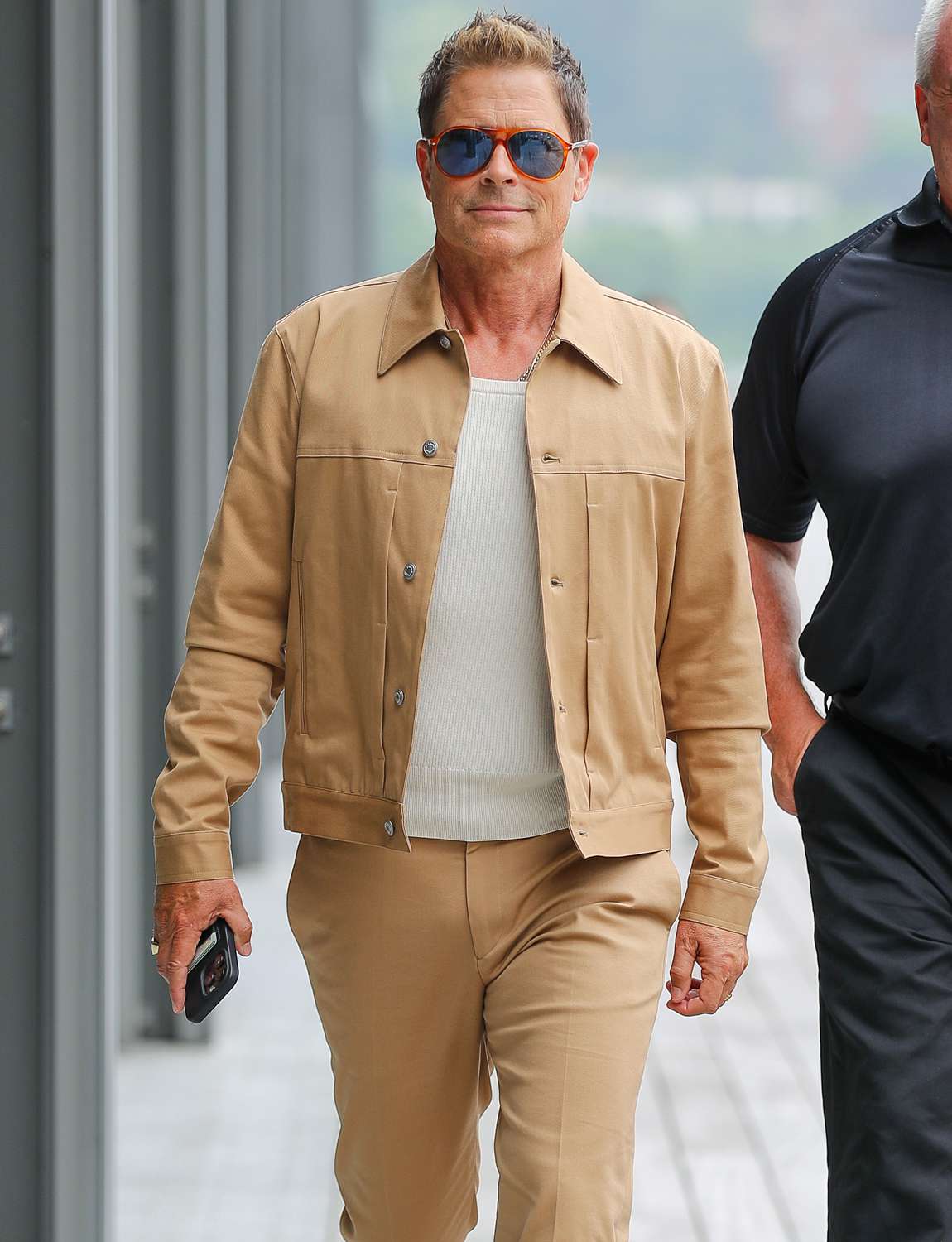 Rob Lowe spotted wearing a beige ensemble while leaving the ESPN studios in New York City.