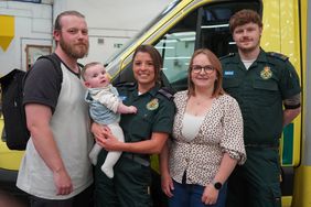 Mom and Newborn Reunited with the Paramedics Who Saved Them. Left to right: Dad Michael, Courtney holding baby Lydia, mum Abie, Corey