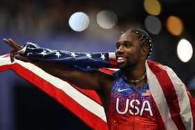 US' Noah Lyles reacts after crossing the finish line in first place, winning the men's 100m final of the athletics event at the Paris 2024 Olympic Games at Stade de France in Saint-Denis, north of Paris, on August 4, 2024. 