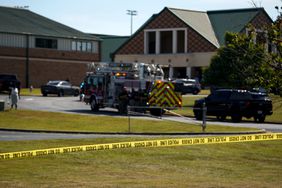 A police line is put up in front of Apalachee High School after a school shooting took place on September 4, 2024 in Winder, Georgia. Multiple fatalities and injuries have been reported and a suspect is in custody according to authorities.