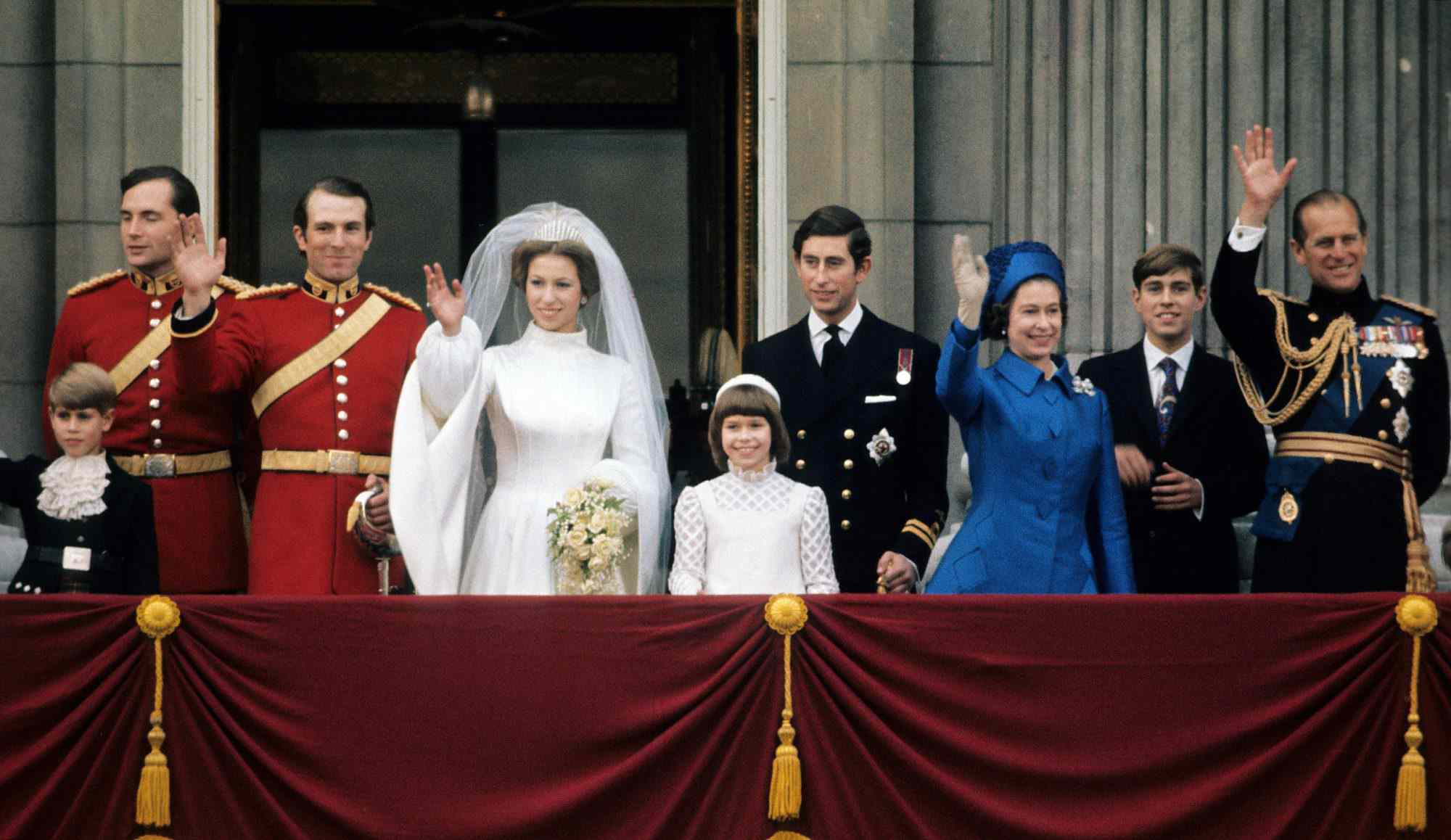 Princess Anne, Princess Royal and Mark Phillips (3rd from left) wave from the balcony of Buckingham Palace following their wedding with Prince Edward, Earl of Wessex (L), Prince Charles, Prince of Wales (4th from right), Queen Elizabeth II (3rd from right), Prince Andrew, Duke of York (2nd right) and Prince Philip, Duke of Edinburgh on November 14, 1973 in London, England.