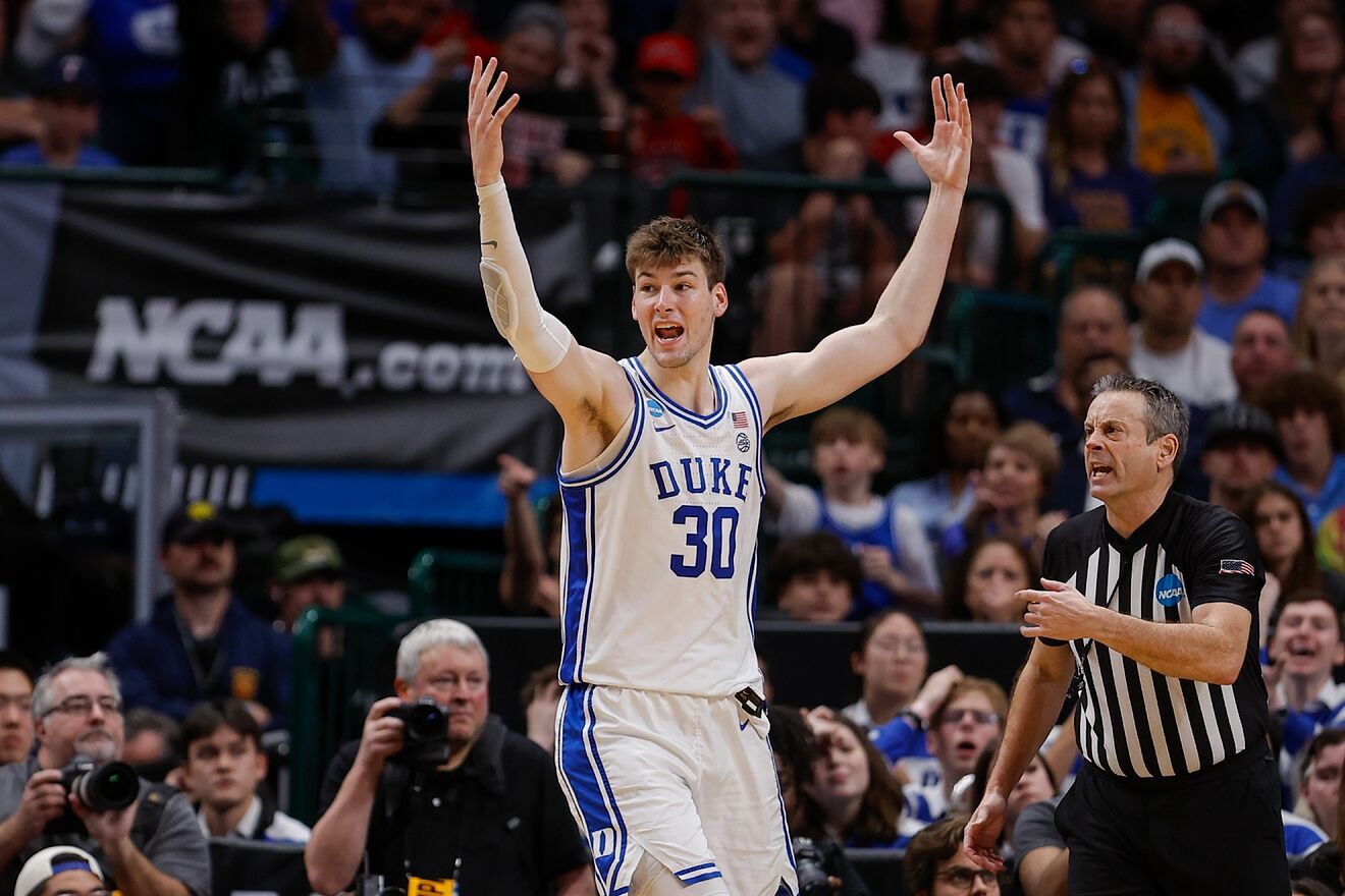 Duke&apos;s Kyle Filipowski reacts while standing next to referee Doug...