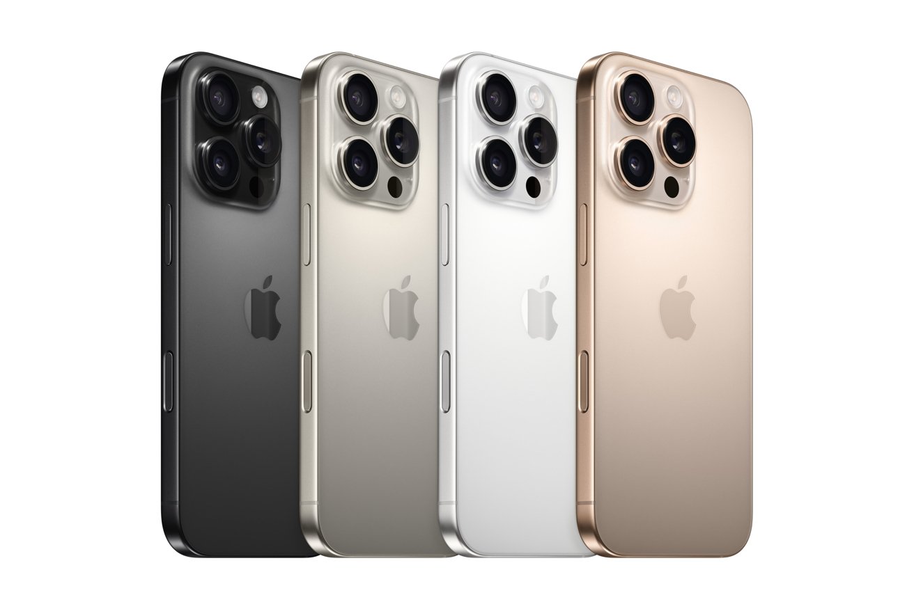 Four iPhones in black, silver, white, and gold, lined up in a row, showcasing the back with triple cameras and the Apple logo.