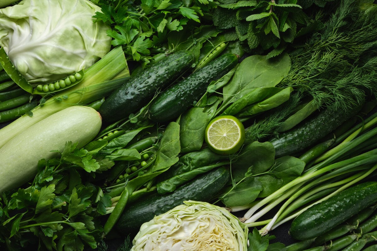 Photo shows dark greens and leafy vegetables, many of which are good plant-based sources of calcium