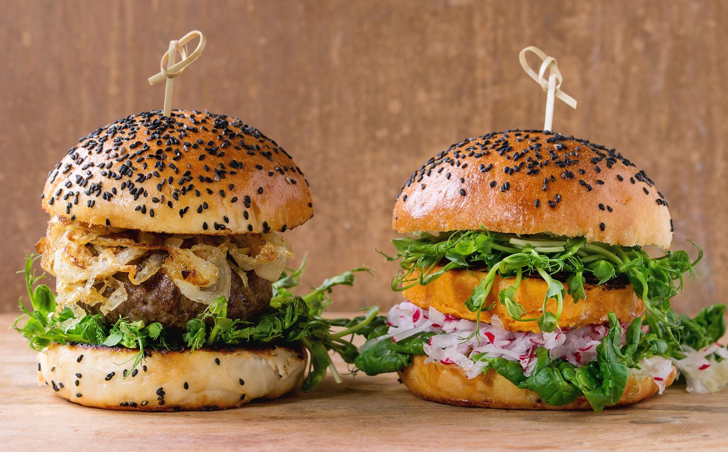 Photo shows a traditional meat-based burger (left) and a plant-based burger (right) side by side