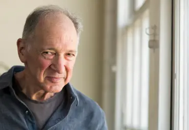 Jerry Skomer, Former owner of Alternative Technologies, stands near window in office